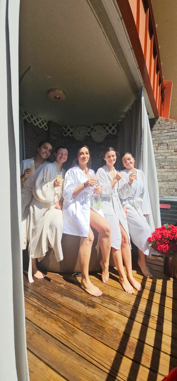 A group of friends in white robes at LeVisa