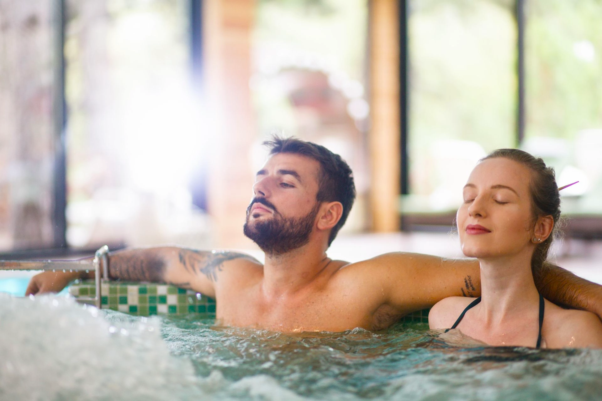Couple relaxing in a hydro-massage tub