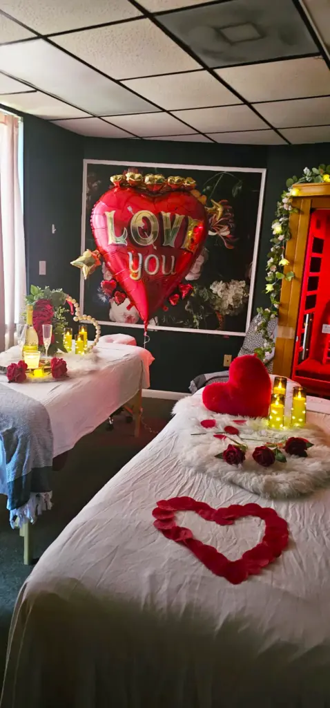 Treatment room decorated with rose petals and a heart