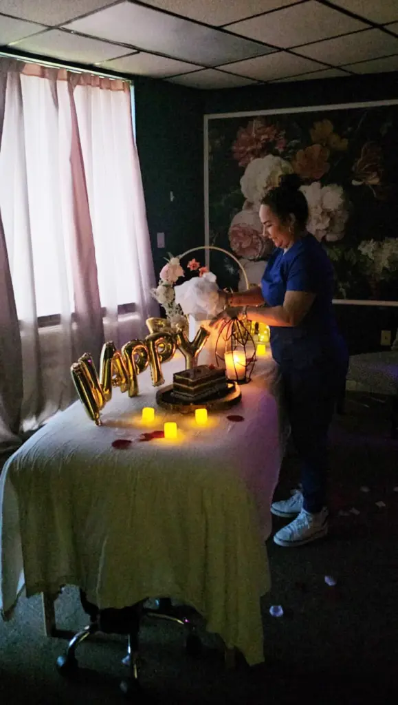 Therapist preparing a decorated treatment room